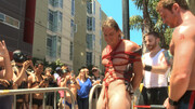 Public Pride Parade humiliation for a BDSM super-sub