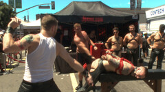 Public Pride Parade humiliation for a BDSM super-sub