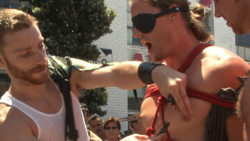 Public Pride Parade humiliation for a BDSM super-sub