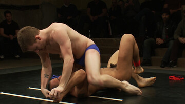 Muscular lovers strip naked to fuck during their wrestling fetish