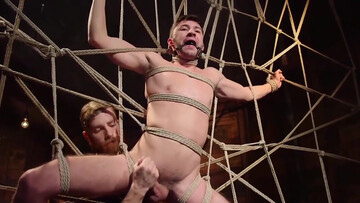 Roped guy endures rough bondage treatment with his horny master