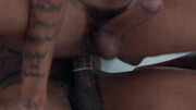Insolent black lovers make out on the couch in highly intense positions