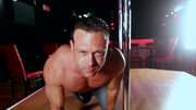 Strong stripper undulates while dancing and plays with his hands over his cock