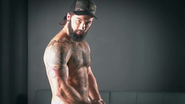 Solo guy with sexy beard jerks that dick until jizz begins to pop all over the couch