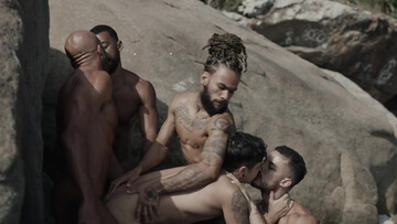 Appealing men fuck by the rocks in outdoor threesome and share great details