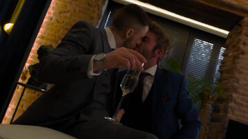 Classy men in suits fuck on the couch until the sperm drops on their shirts