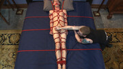 Twink sits tied up in ropes while his master abuses his huge cock