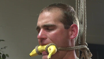 Roped male lets one of the college boys play with him in raw maledom