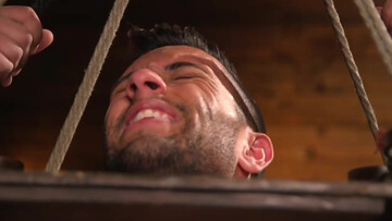 Restrained man gets dominated in sexual perversions by gay master with a huge cock