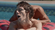 Twink tracing patterns on a hard cock in a swimming pool