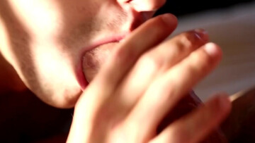 Slutty brunette guy licking all over that penis tip