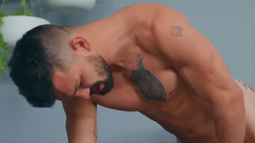 Horny men gag one another before they fuck on the couch