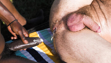 Black bulls share white guy for surreal outdoor anal perversions
