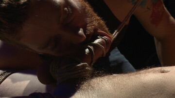 Dazed smile from a top who sniff his bottom's horny crotch