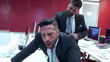 Office hunk taking care of his prey in front of the computer